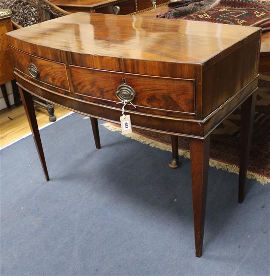 A George III mahogany bow fronted two drawer side table W.107cm